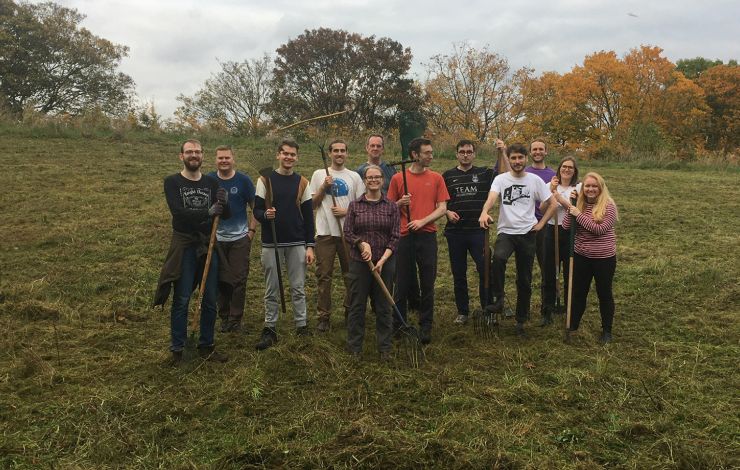  Steer Sustainable Transport team clearing meadow grass in Burgess Park, London.